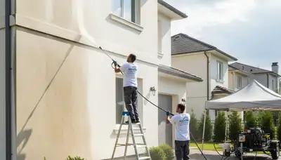 Pressure cleaning driveway and siding in Chicago, IL by Chicago Paint Pros